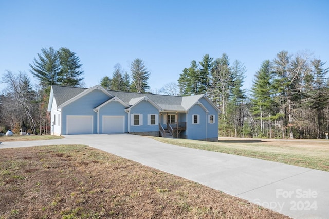 ranch-style home with a front lawn and a garage