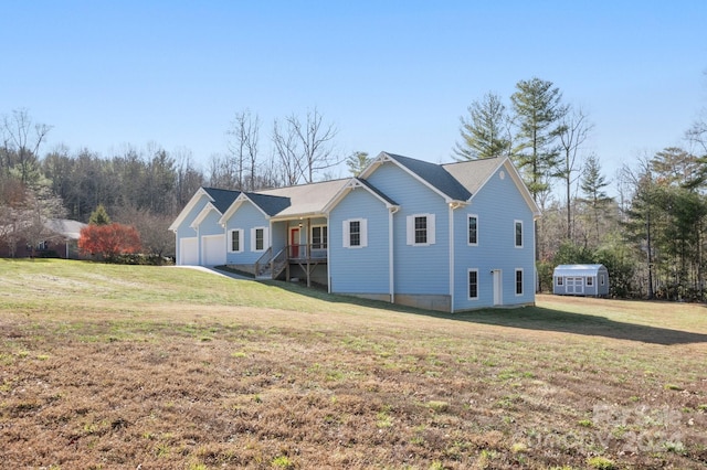 view of front of home featuring a garage, covered porch, and a front lawn