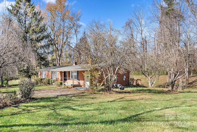 view of front of home with a front lawn and a porch