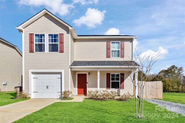 front of property with a garage and a front lawn