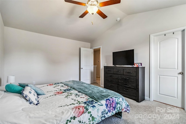 carpeted bedroom featuring ceiling fan and lofted ceiling