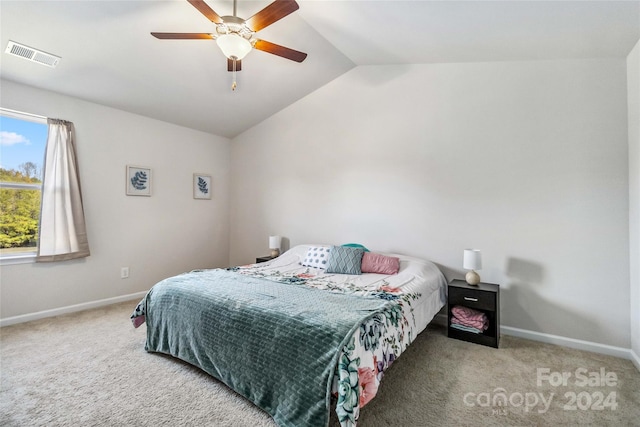 carpeted bedroom featuring ceiling fan and lofted ceiling