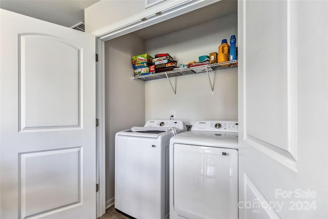 laundry area with independent washer and dryer