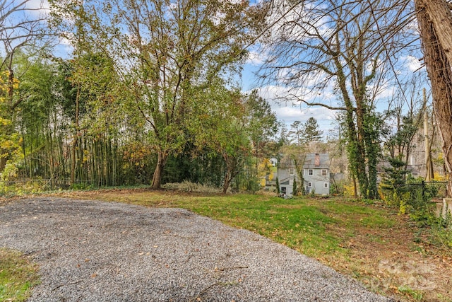 view of road featuring gravel driveway