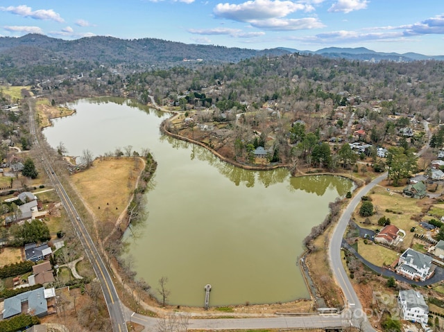 drone / aerial view with a water and mountain view