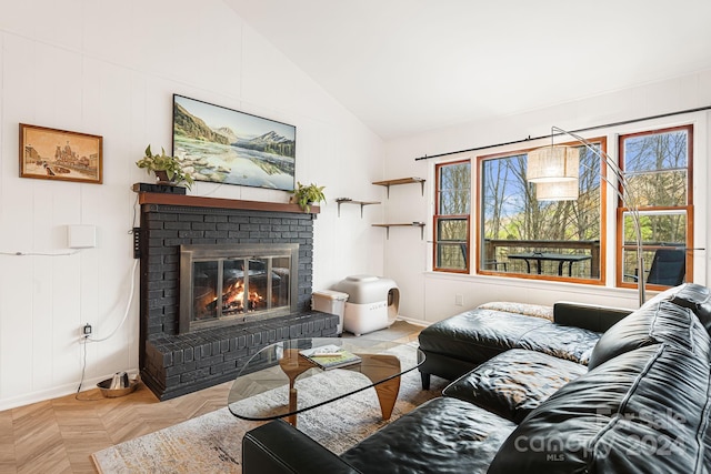 living room featuring a fireplace, light parquet flooring, and vaulted ceiling