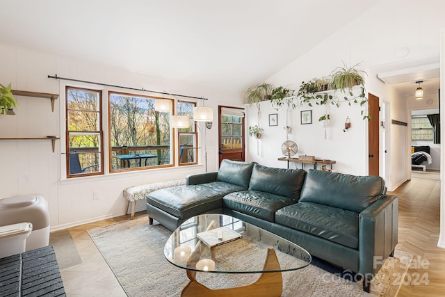 living room featuring vaulted ceiling