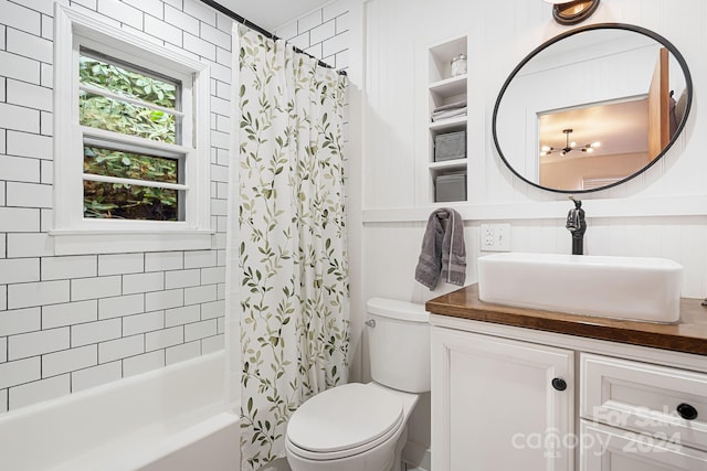 full bathroom featuring vanity, shower / bathtub combination with curtain, and toilet