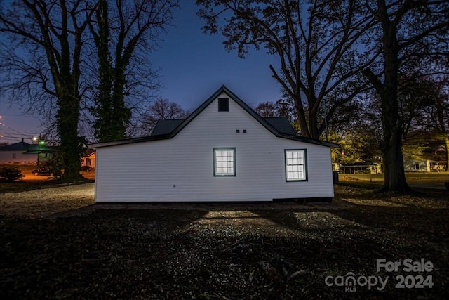 view of property exterior at dusk