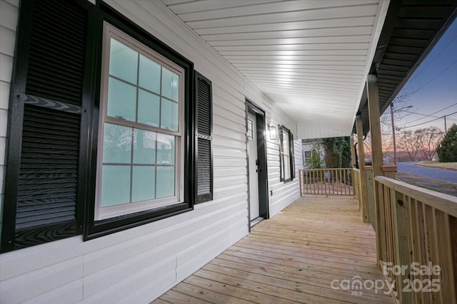 wooden deck featuring covered porch