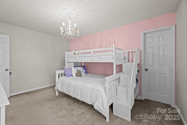 bedroom featuring a chandelier and light colored carpet