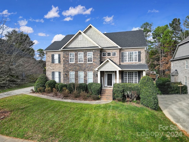 view of front of property with a front lawn