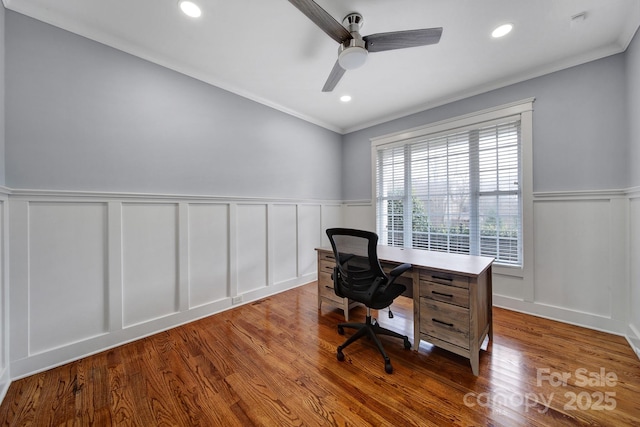 home office with hardwood / wood-style flooring, crown molding, and ceiling fan