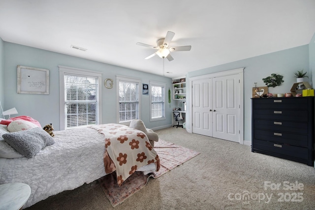 bedroom with multiple windows, carpet floors, and ceiling fan