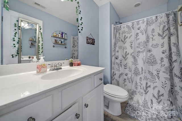 bathroom with vanity, toilet, and a shower with shower curtain