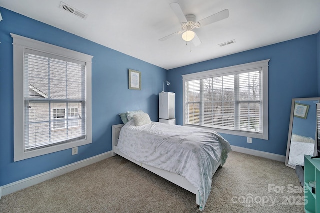 bedroom with ceiling fan and carpet floors