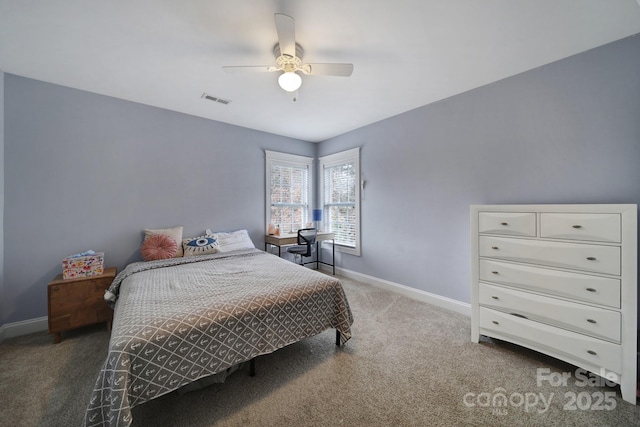 bedroom featuring dark carpet and ceiling fan