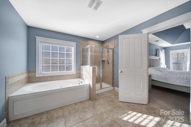 bathroom featuring plus walk in shower and tile patterned floors