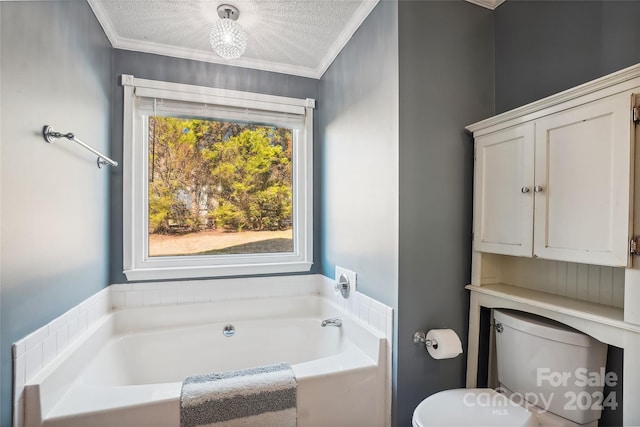 bathroom with a bathing tub, crown molding, a textured ceiling, and toilet