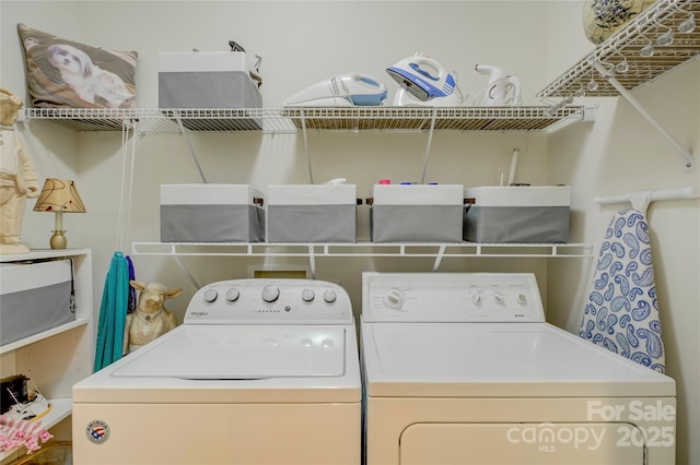 laundry area featuring laundry area and washer and dryer