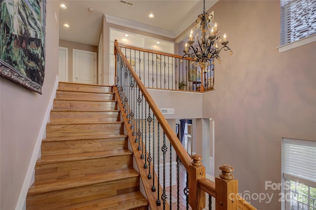 stairway with baseboards, visible vents, a chandelier, and recessed lighting