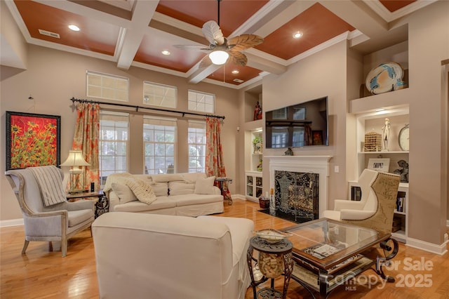 living room with light wood-type flooring, visible vents, baseboards, and coffered ceiling