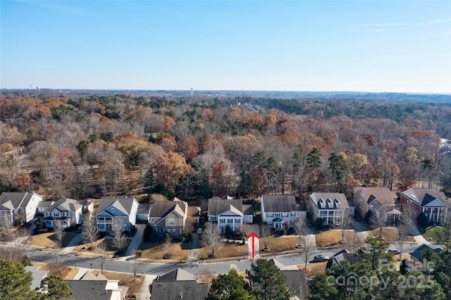 aerial view with a residential view and a view of trees