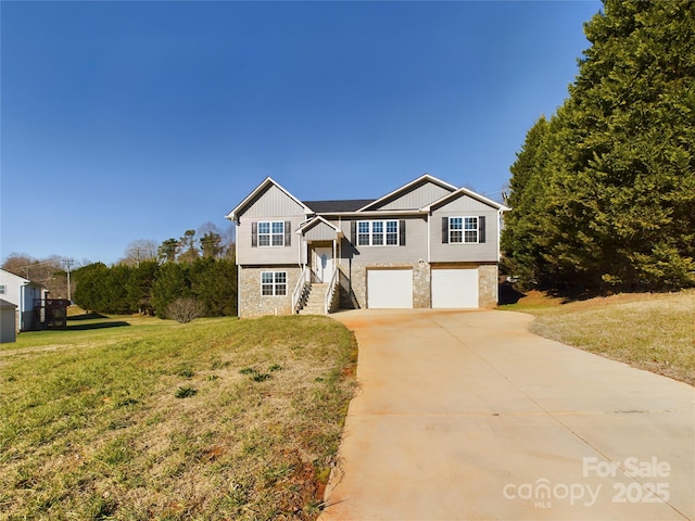 view of front of house with a garage and a front yard