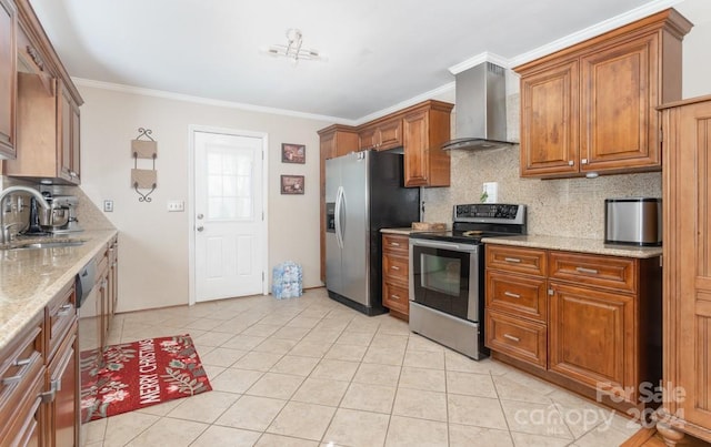 kitchen with light stone countertops, sink, stainless steel appliances, wall chimney range hood, and decorative backsplash