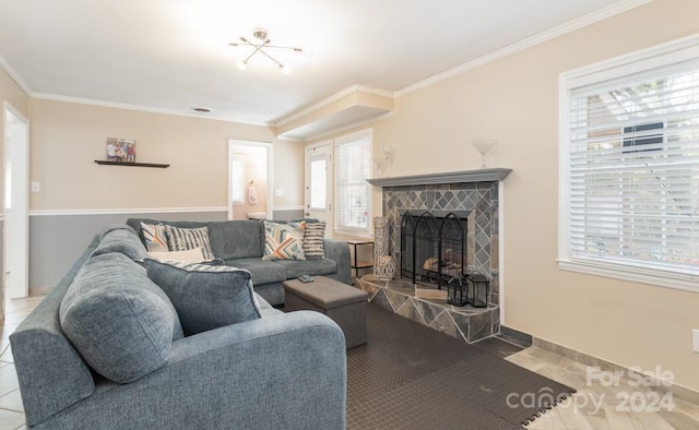 tiled living room featuring a fireplace, plenty of natural light, and ornamental molding