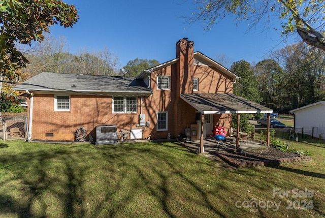 rear view of house featuring central AC, a patio area, and a lawn