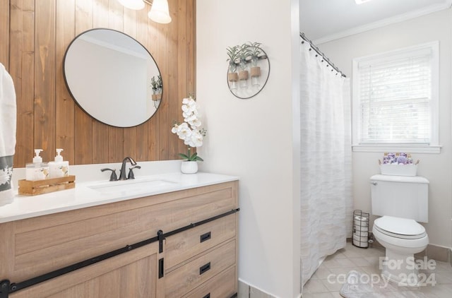 bathroom with toilet, tile patterned flooring, vanity, and ornamental molding