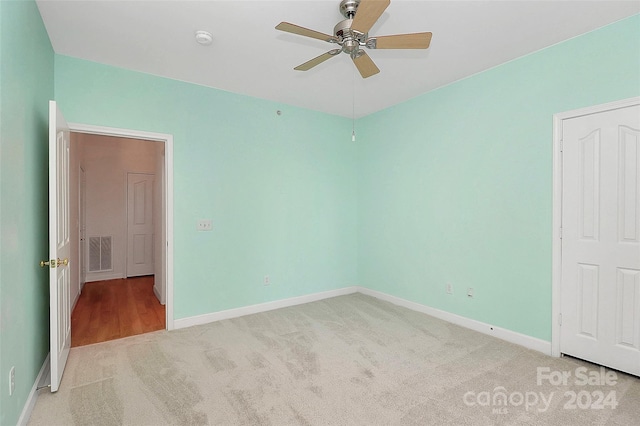 unfurnished bedroom with carpet flooring and ceiling fan