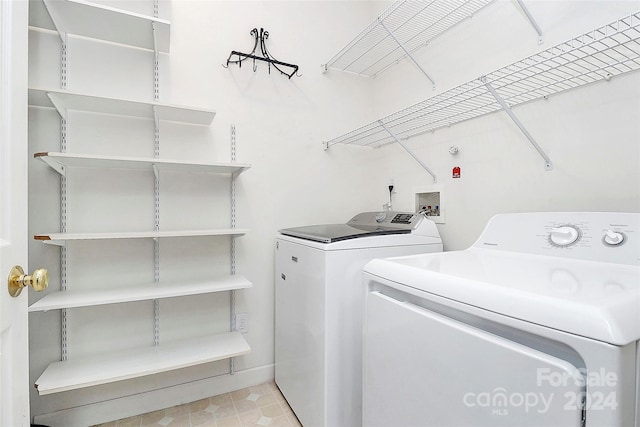 laundry room with washing machine and clothes dryer