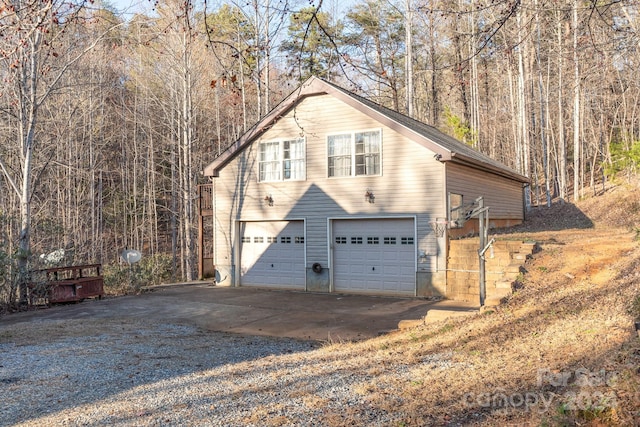 view of side of property with a garage