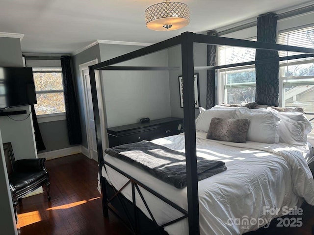 bedroom featuring dark hardwood / wood-style floors and ornamental molding