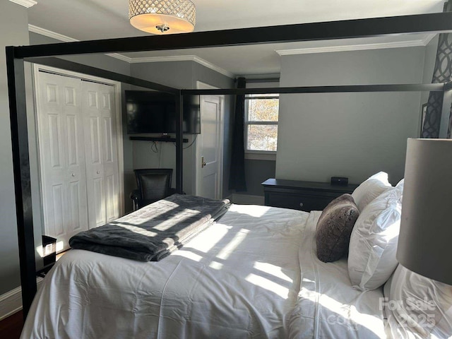 bedroom featuring a closet and ornamental molding