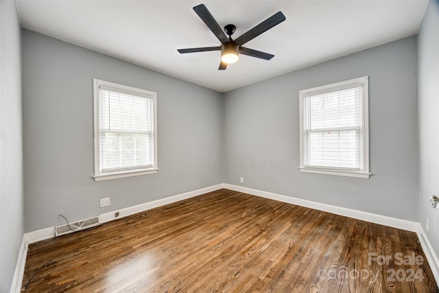 unfurnished room featuring hardwood / wood-style flooring, plenty of natural light, and ceiling fan