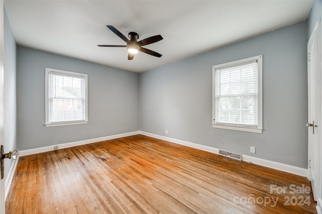 unfurnished room featuring ceiling fan, plenty of natural light, and light hardwood / wood-style floors