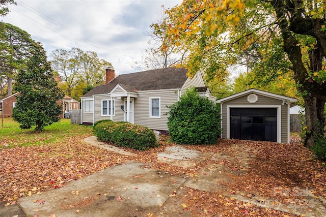 view of front of house with an outdoor structure and a garage