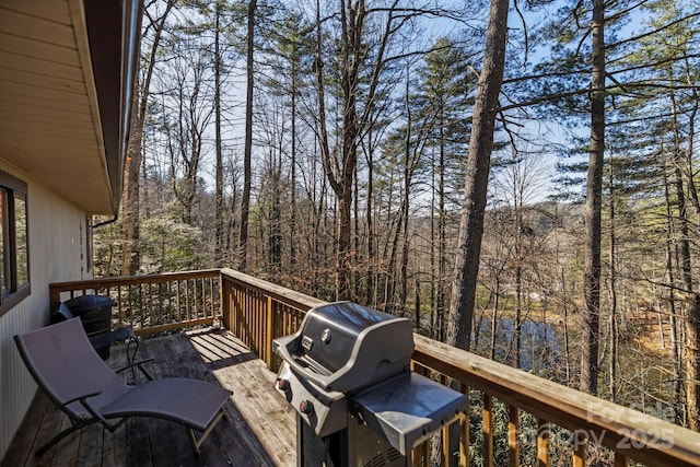 wooden terrace with area for grilling