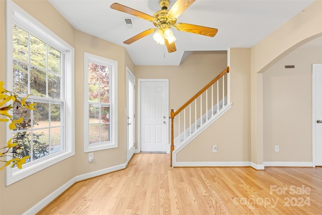 entrance foyer with ceiling fan and light hardwood / wood-style floors