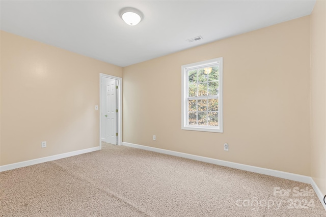 spare room with carpet floors