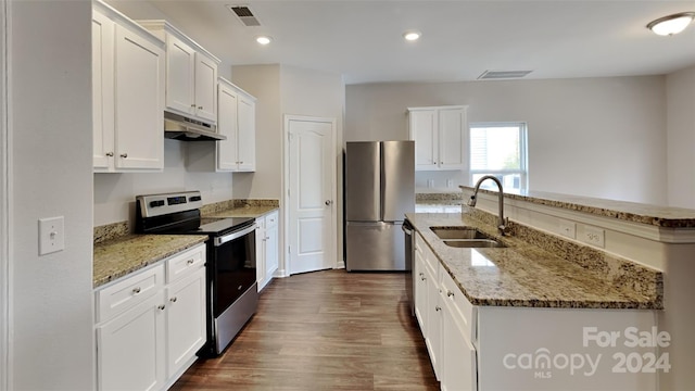 kitchen with stainless steel appliances, sink, a center island with sink, dark hardwood / wood-style floors, and white cabinetry