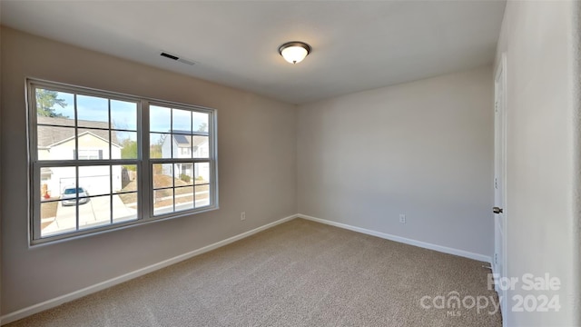 view of carpeted spare room