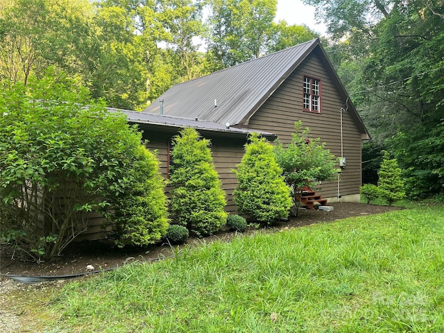 view of property exterior with a yard