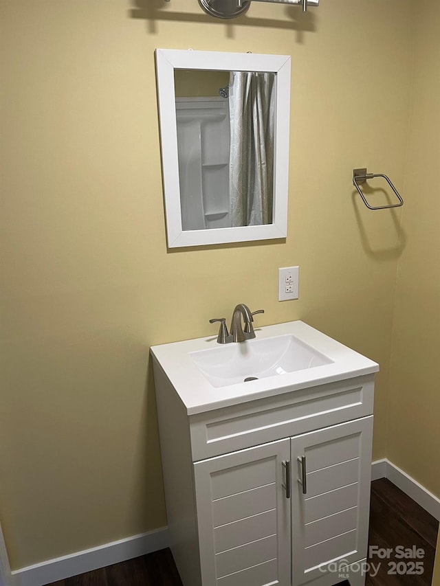 bathroom with vanity and wood-type flooring