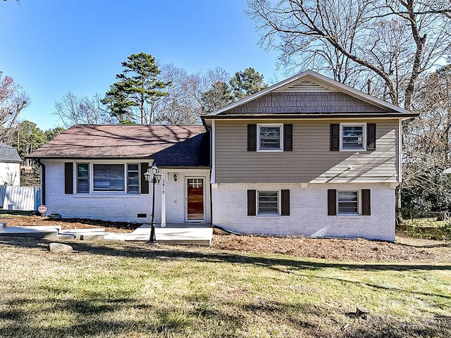 tri-level home featuring a front yard