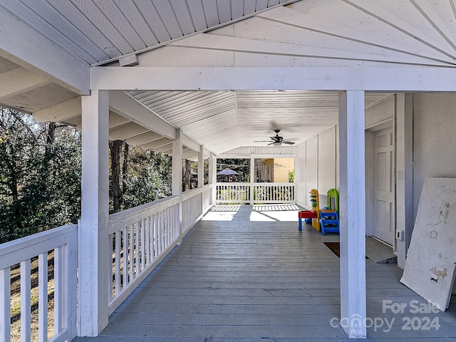 wooden deck featuring ceiling fan