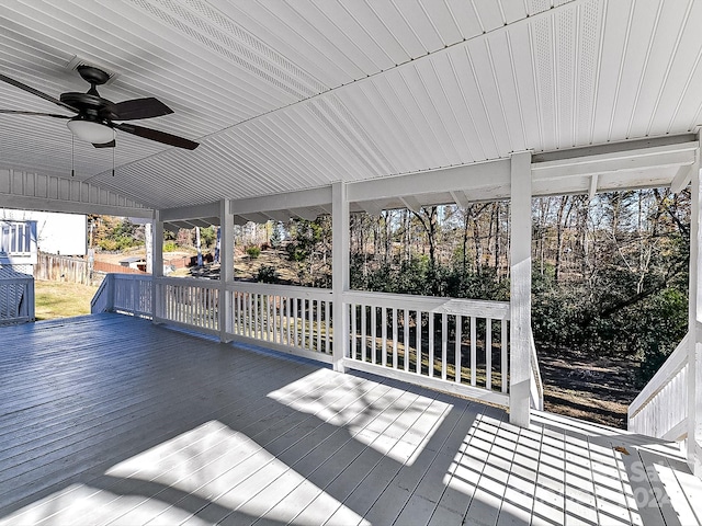 unfurnished sunroom with wooden ceiling, a wealth of natural light, lofted ceiling, and ceiling fan